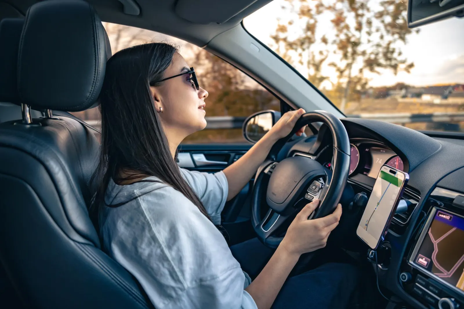Driving coach with both hands on the wheel during a lesson in Taiwan