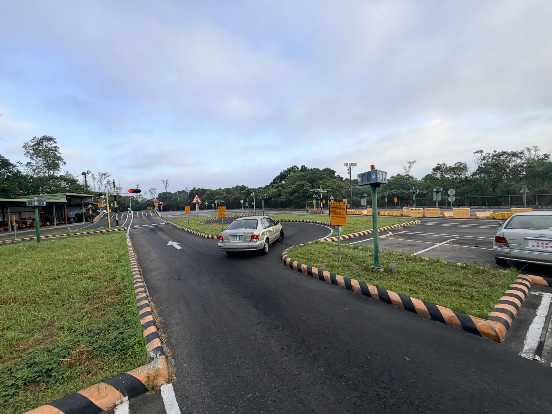 Learner driving confidently on a Taiwan road during a lesson